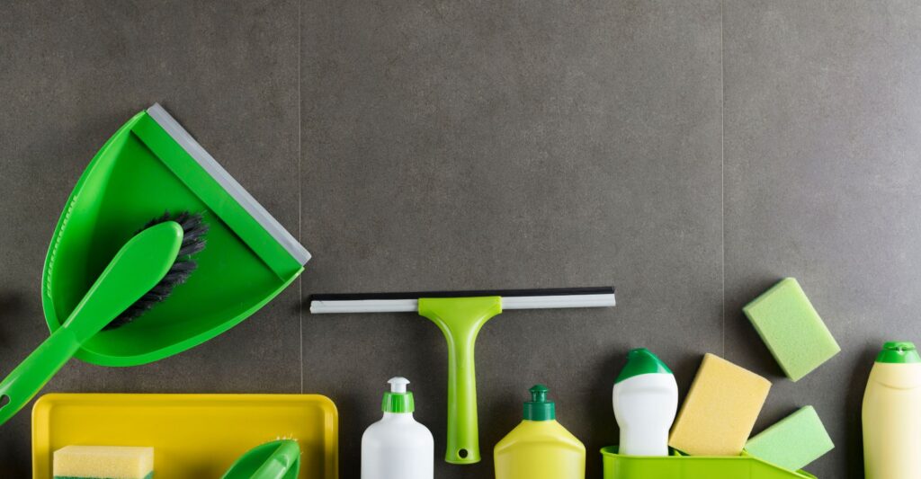 a group of cleaning supplies on a grey surface