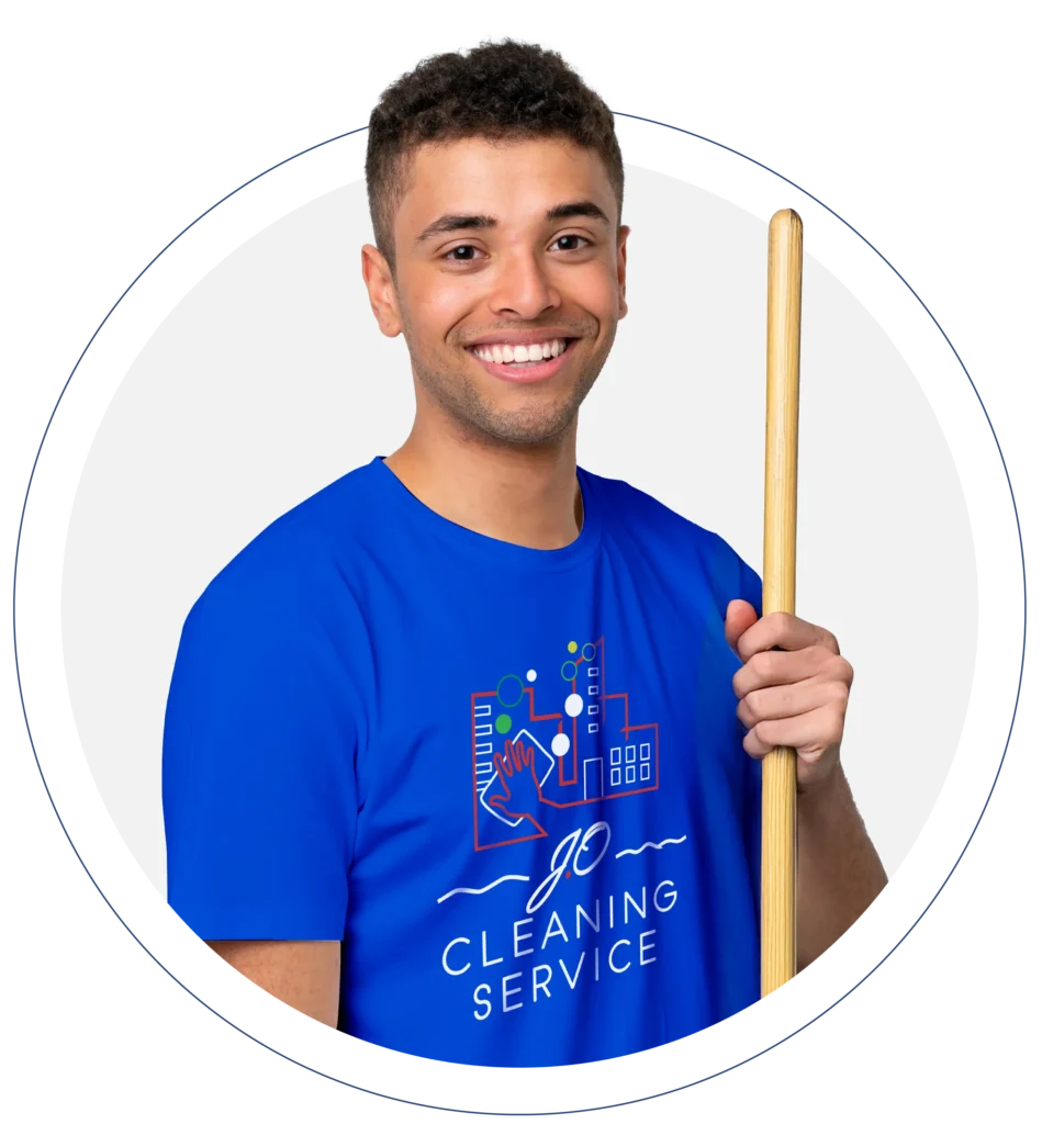 a man holding a broom