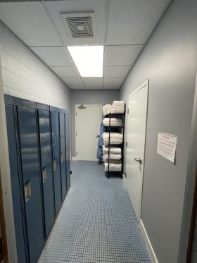 Pool locker room with towel rack